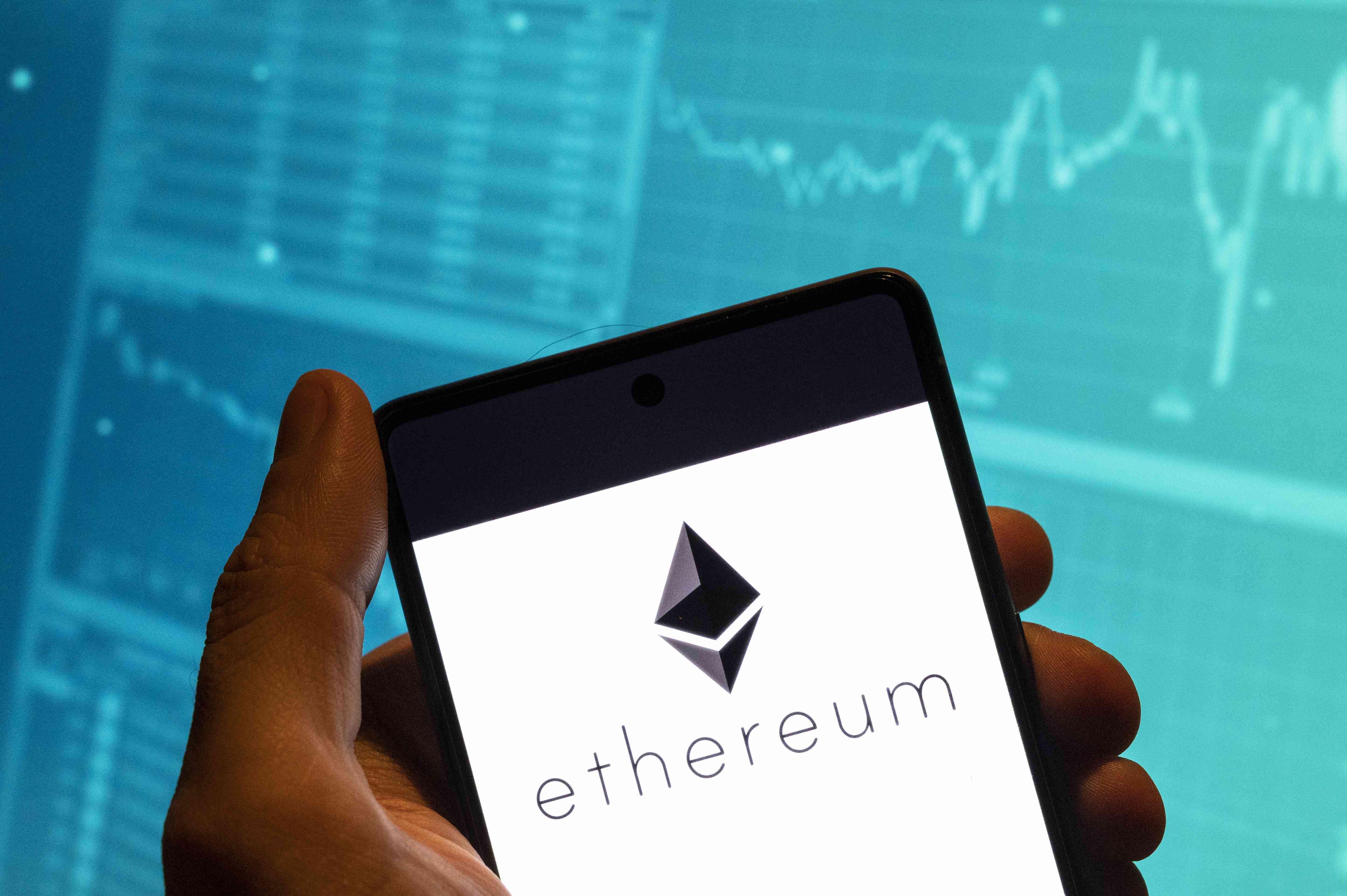 Ethereum displayed on a mobile phone in someone's hand.