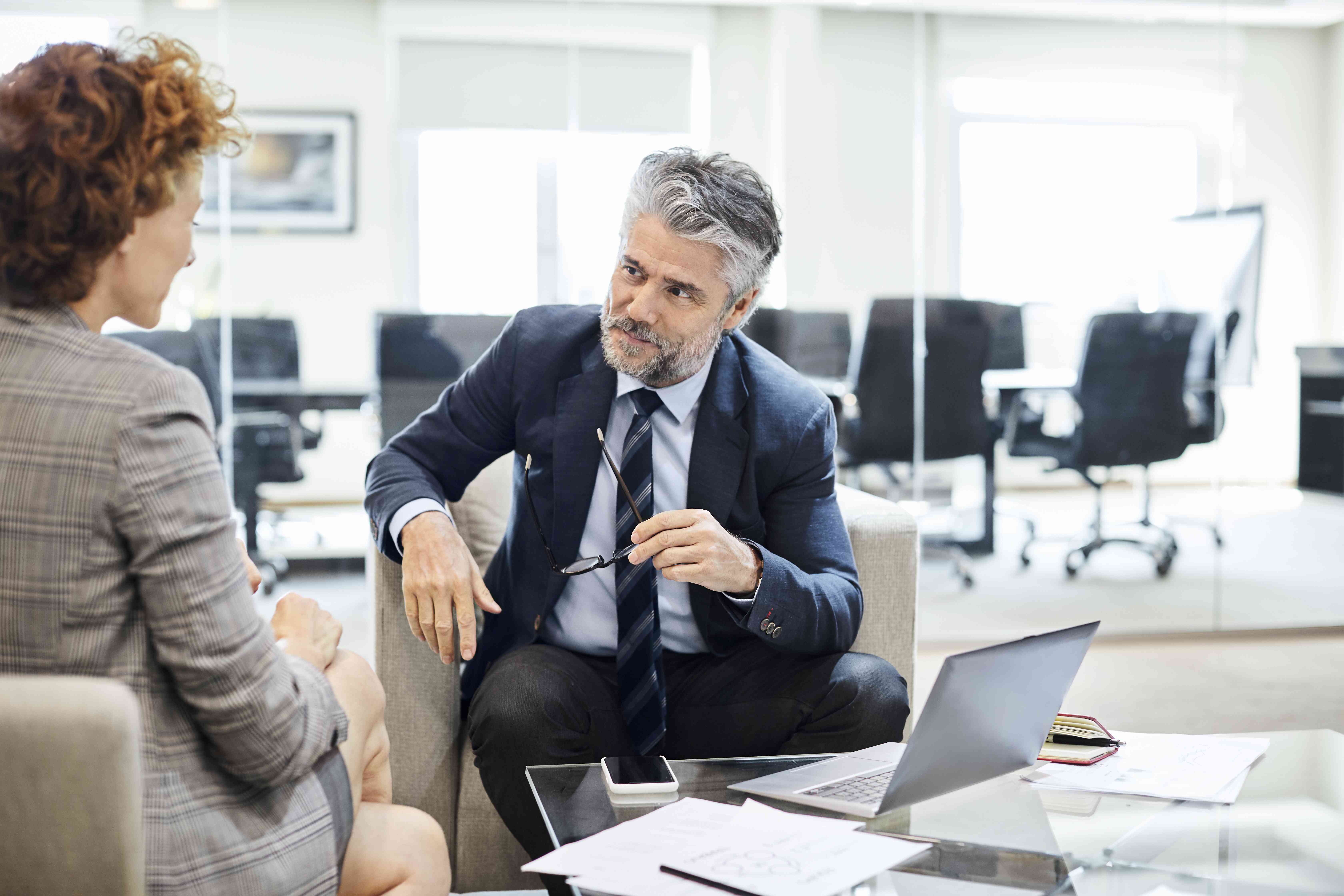 A banker meets with a hedge fund manager to discuss structuring investments to suit the needs of the fund.